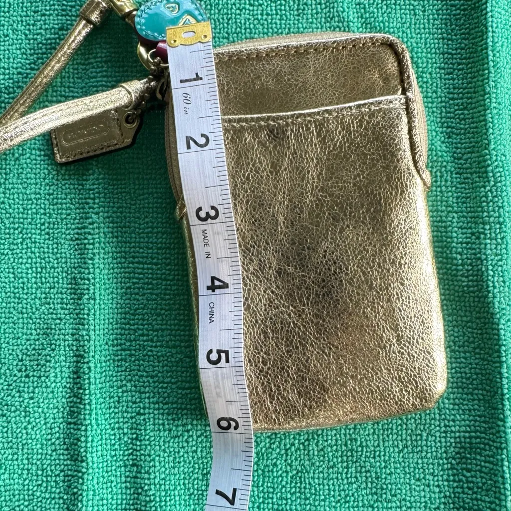 Coach Metallic Gold Wristlet with Embossed Design - Image 6