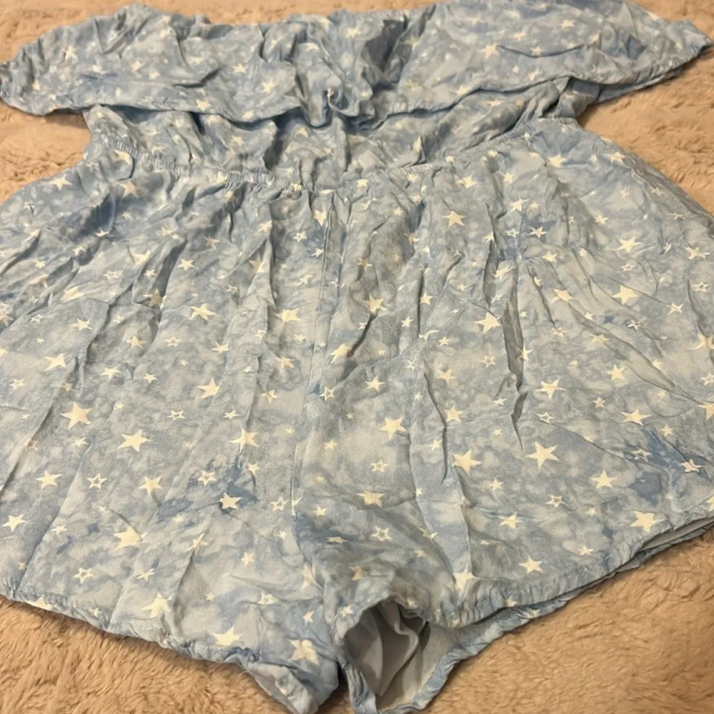 Star print romper in size L Size L - Image 2