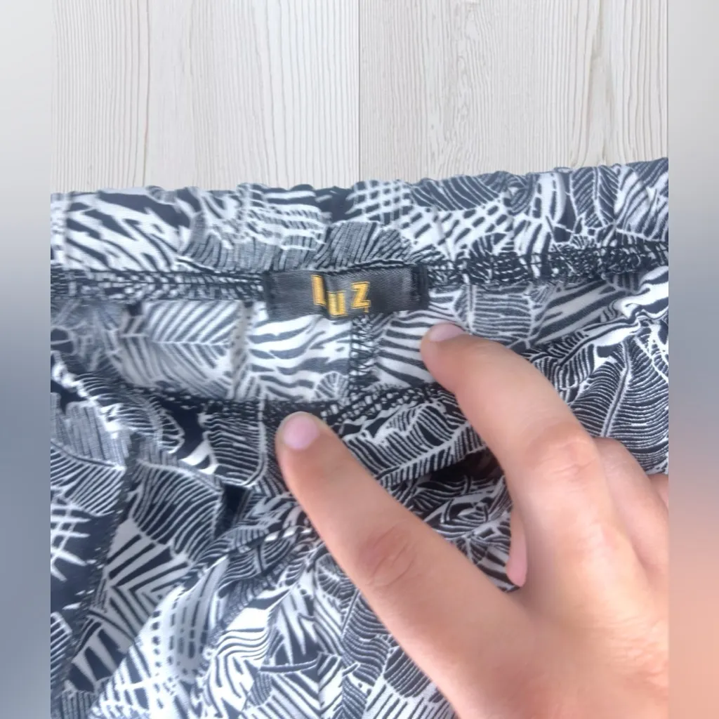 LUZ Women’s Sheer Flowy Tropical Shorts Black - Image 4