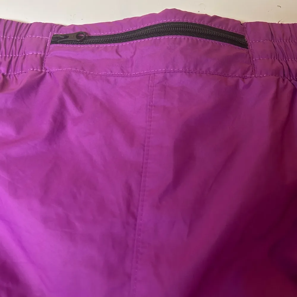 Purple north face running shorts with back zip pocket and reflectors - Image 4