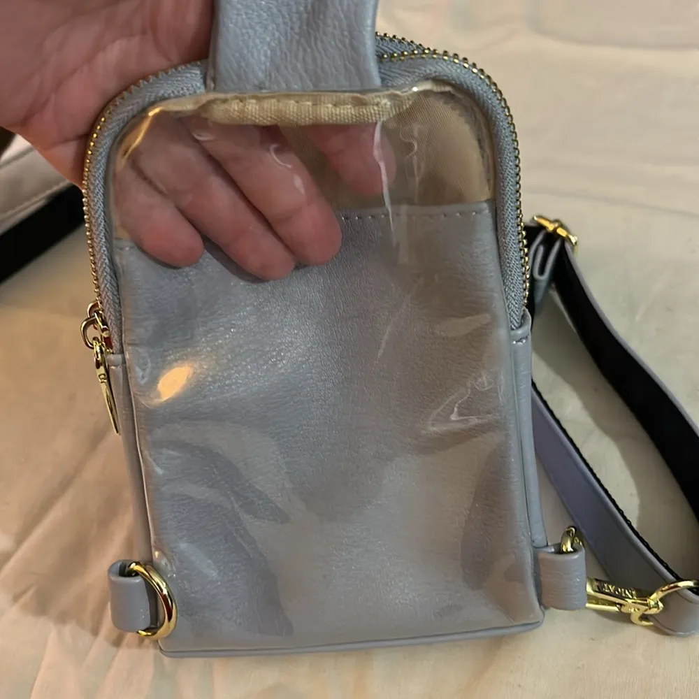 baby blue inicat crossbody bag with gold zippers and clip - Image 4