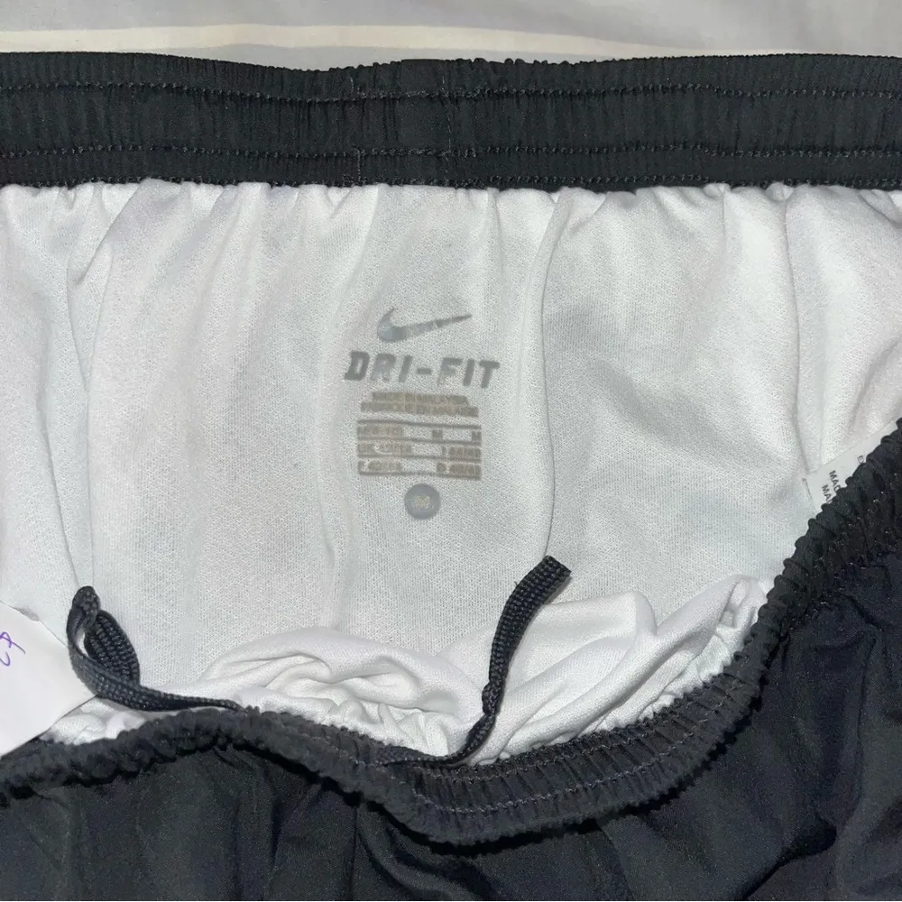 NIKE gray tempo shorts with yellow trim, medium - Image 4