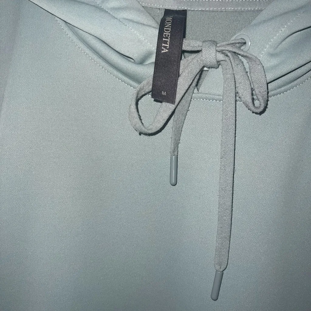 mbrace a sleek, minimalist fashion style with this beautiful sage green hoodie, - Image 3