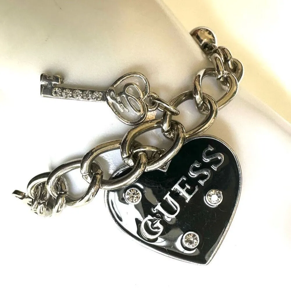 GUESS SILVER TONE CHAIN BLACK HEART CRYSTAL LOGO LOCK & KEY CHARM BRACELET - Image 3