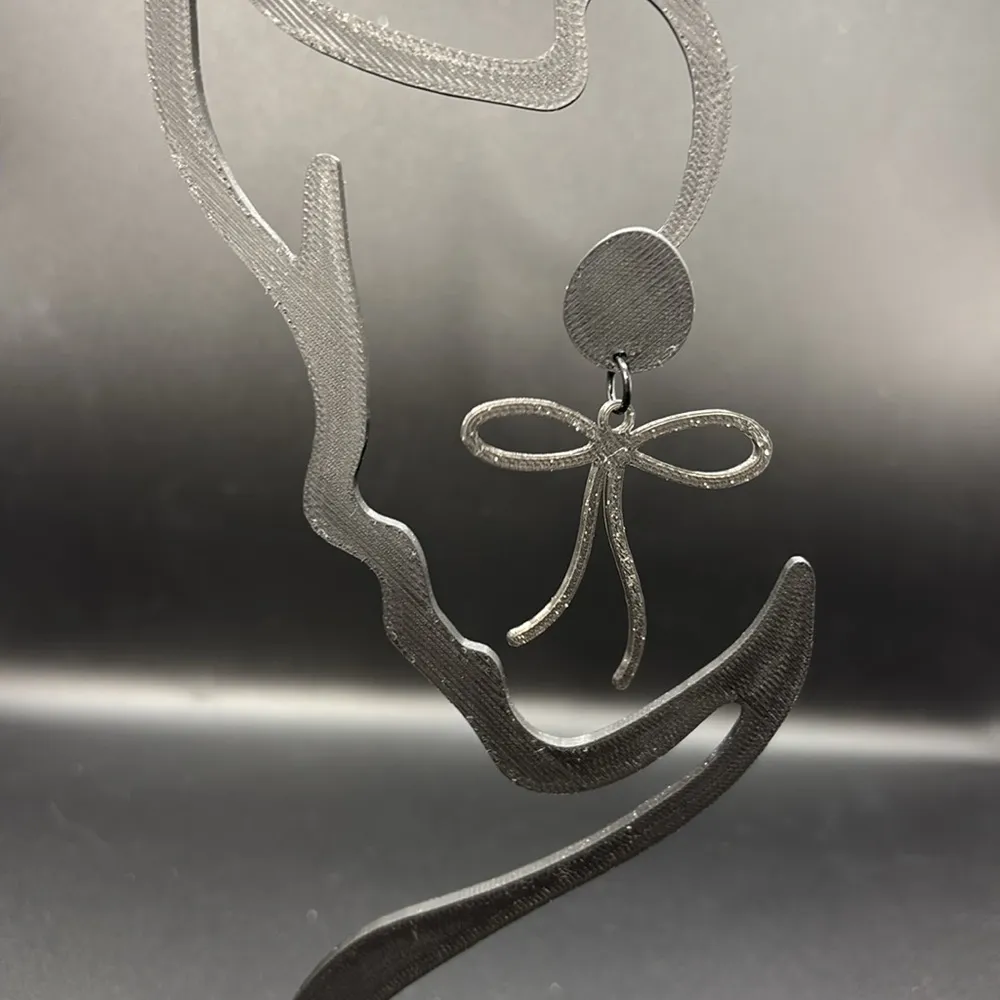 Elegant Black Glitter Bow Earrings - Image 2