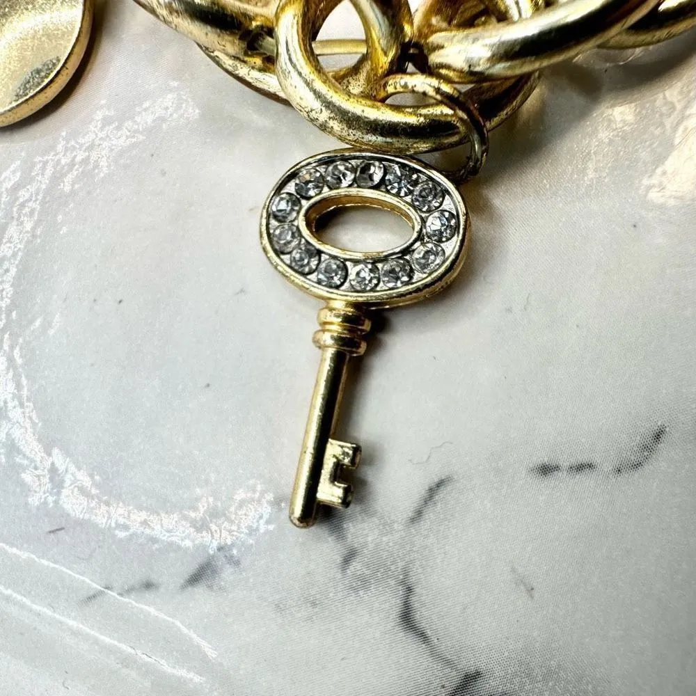 Jennifer Lopez gold tone rhinestone charm bracelet - Image 11