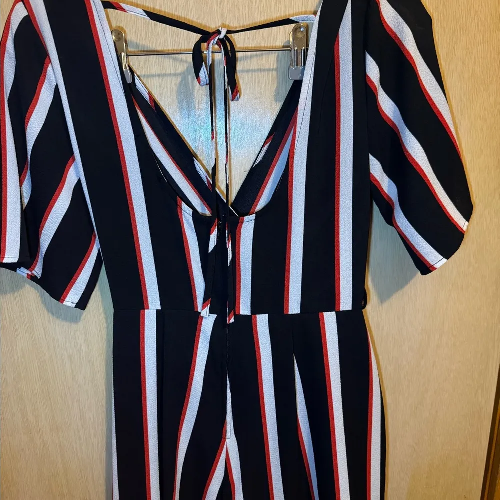 Black Romper with Bold White and Red Stripes - Image 5
