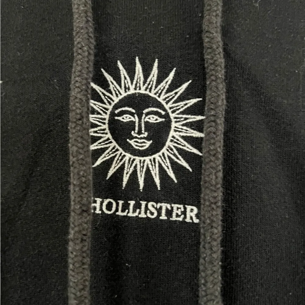 Hollister Black Hoodie with Sun Design - Image 2