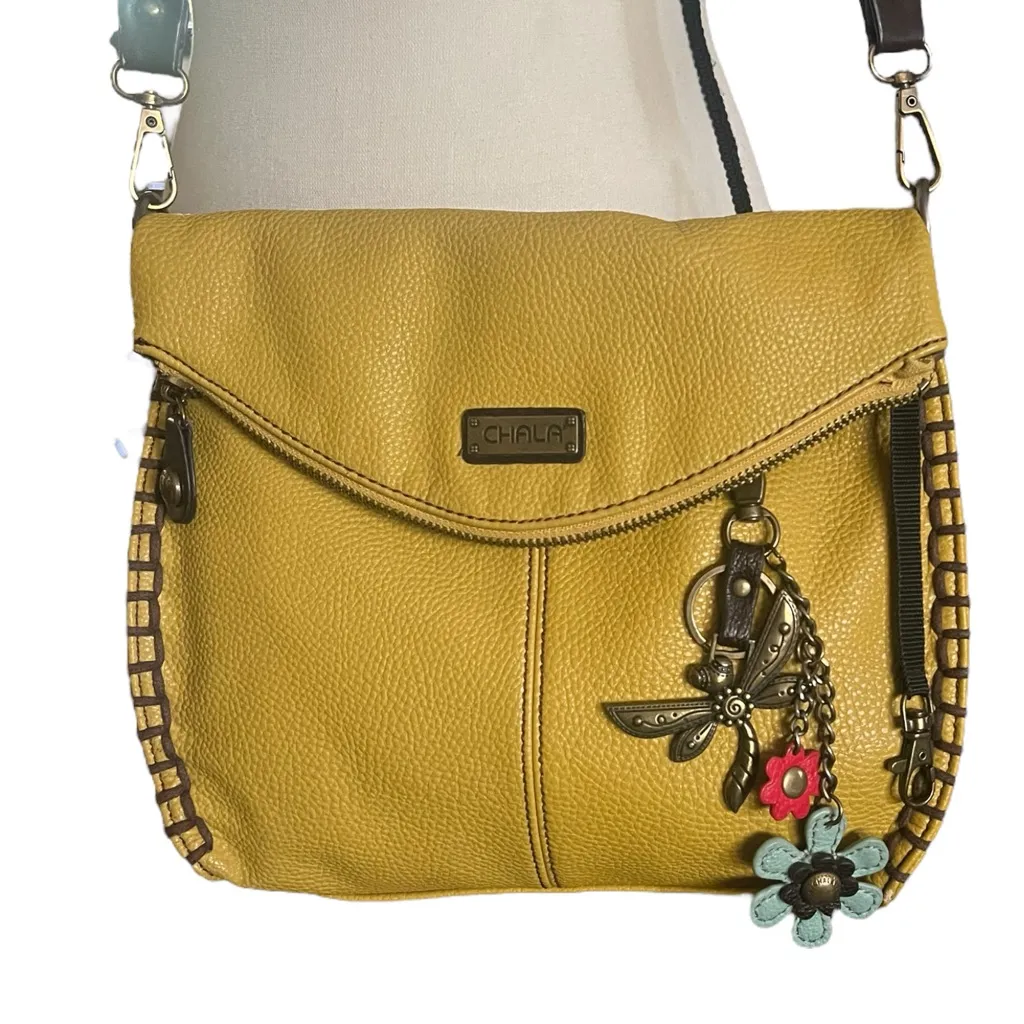 CHALA Mustard Pebbled Leather Crossbody Handbag with Dragonfly Charm. - Image 1