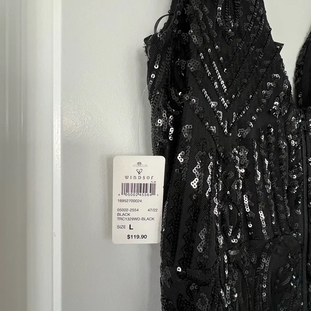 Elegant Black Sequin Gown with Feather Details - Image 5