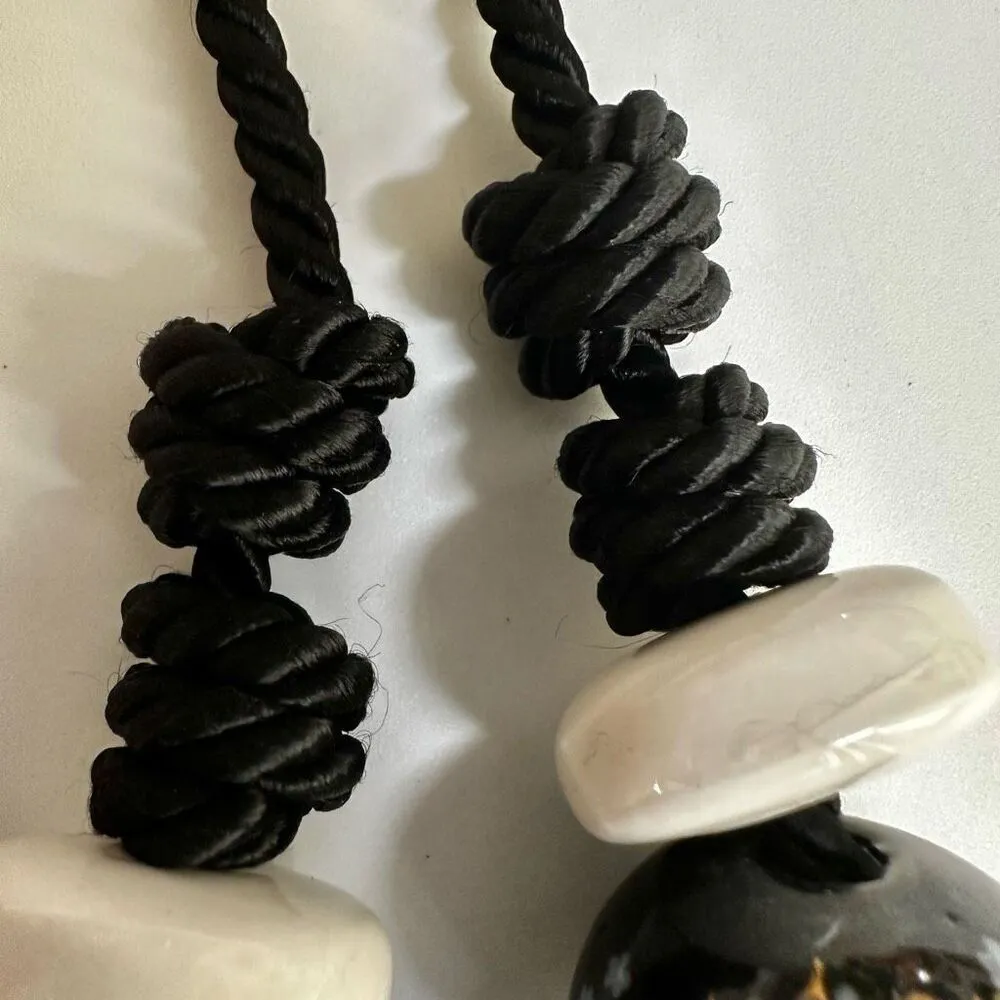 Black floral and white beaded necklace on black cord - Image 9