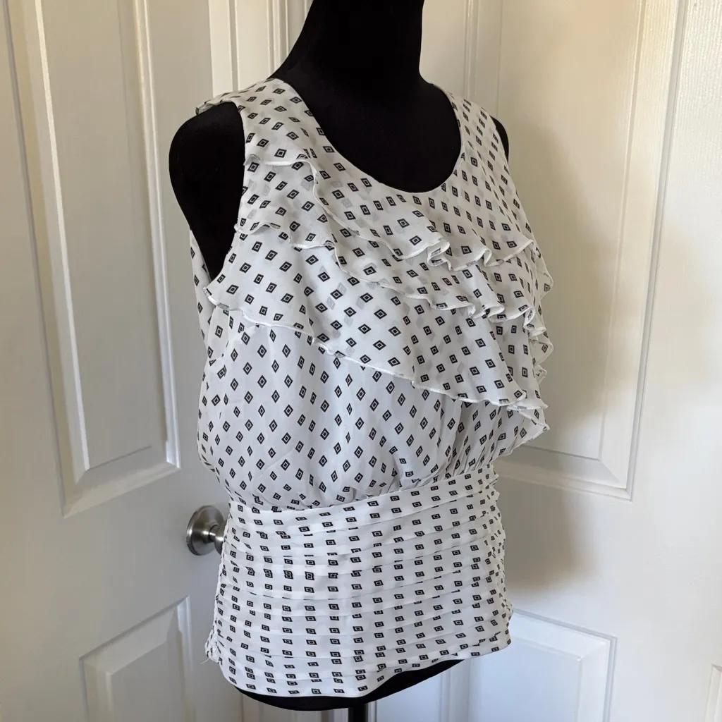 White House Black Market Sleeveless Blouse with Diamond Print and Ruffle Detail. - Image 2