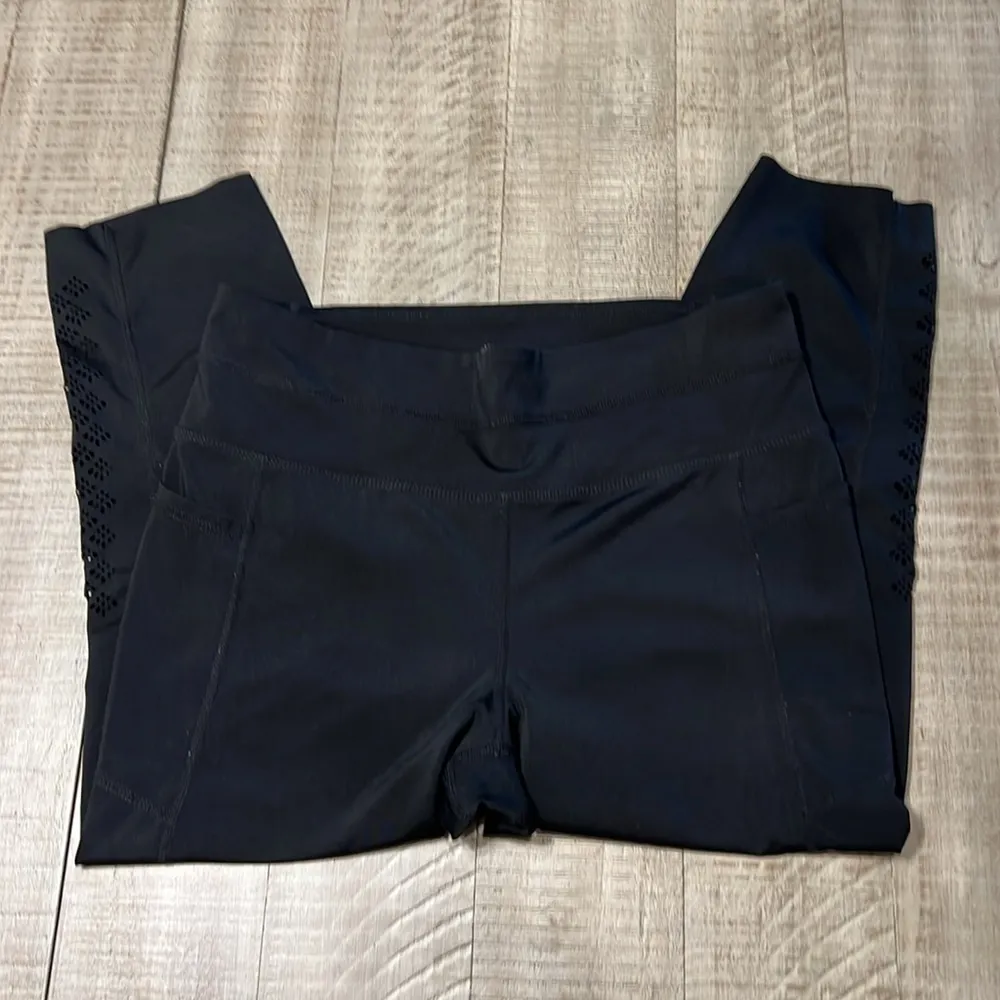 3:$25 Tangerine capri leggings with cute cut outs down outside of each calf. - Image 2