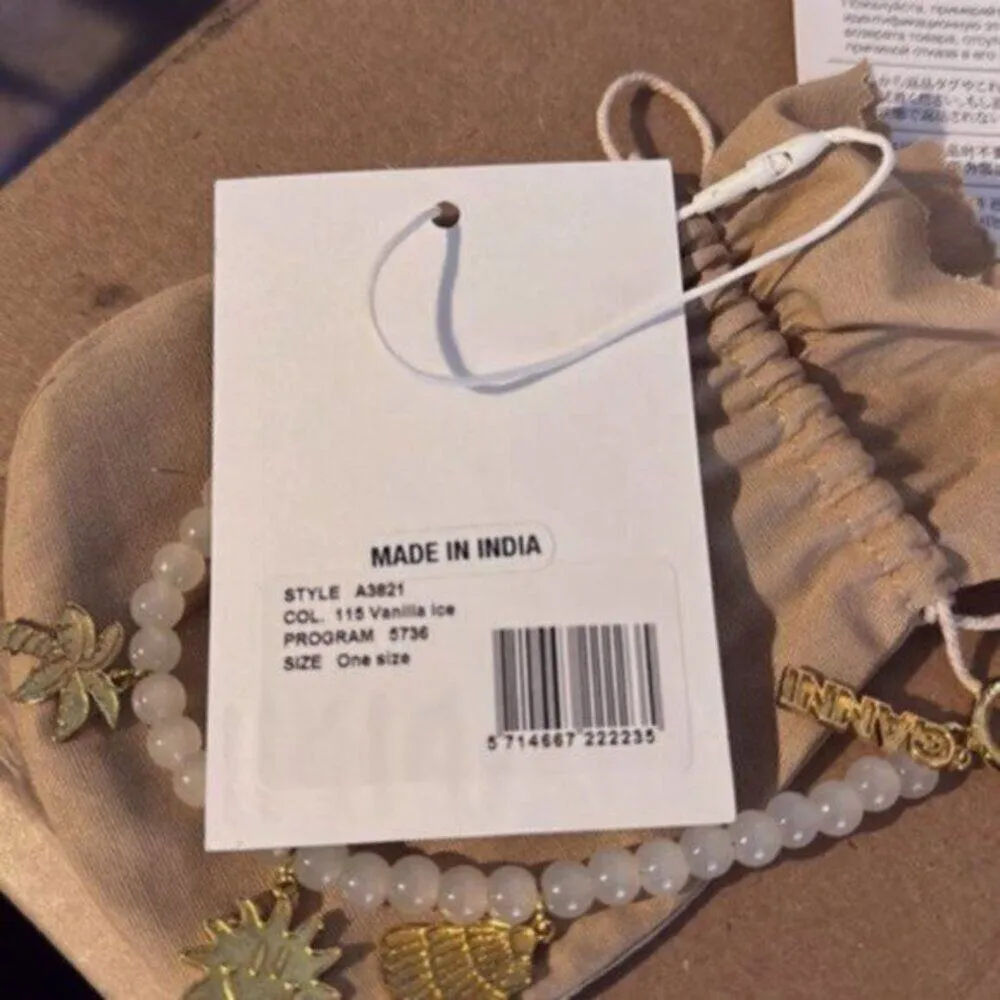 Ganni White beaded bracelet with gold charms - Image 7