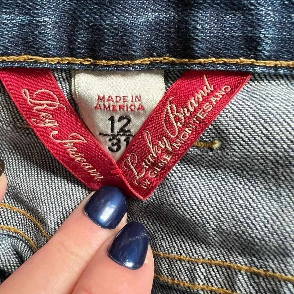 Lucky Brand lightly distressed bootcut medium wash jeans size 12 - Image 13