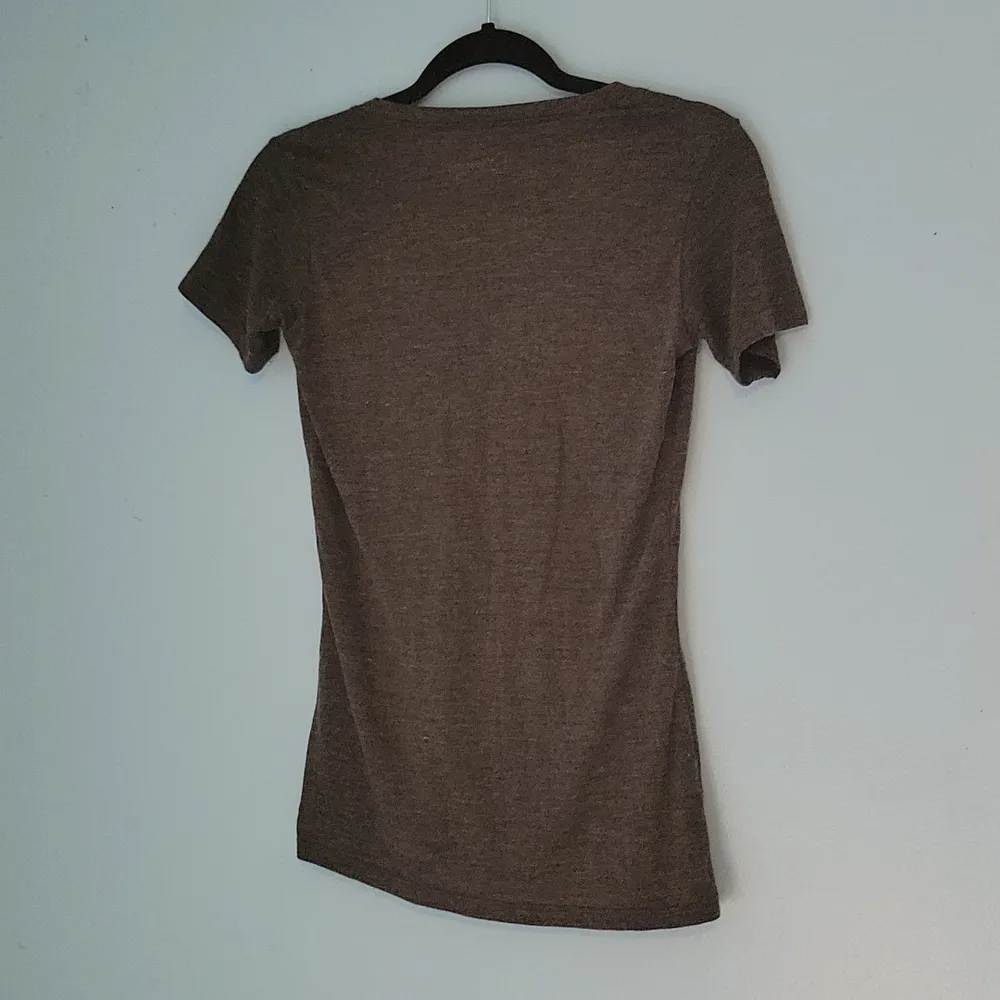 NWT Alice In Wonderland "We're All Mad Here" Black Tee Size Small - Image 4