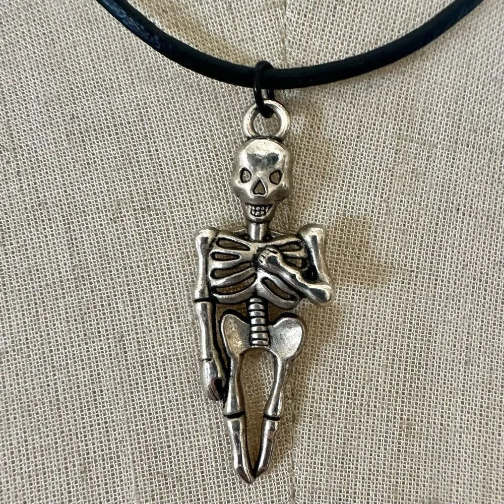Silver tone skeleton pendant necklace on black cord - Image 2