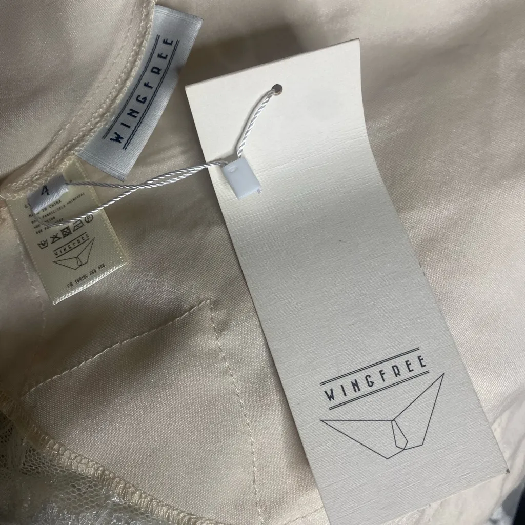 NWT WINGFREE Ivory Satin Midi
Slip Dress with Lace & Ruched Detail
XS/S - Image 9