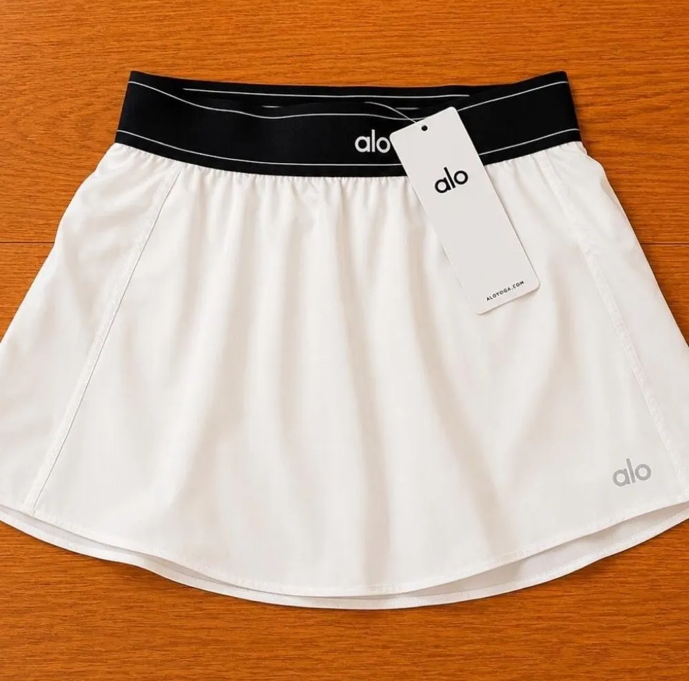 Alo Women's White Tennis Skirt with Black Waistband - $53 - From