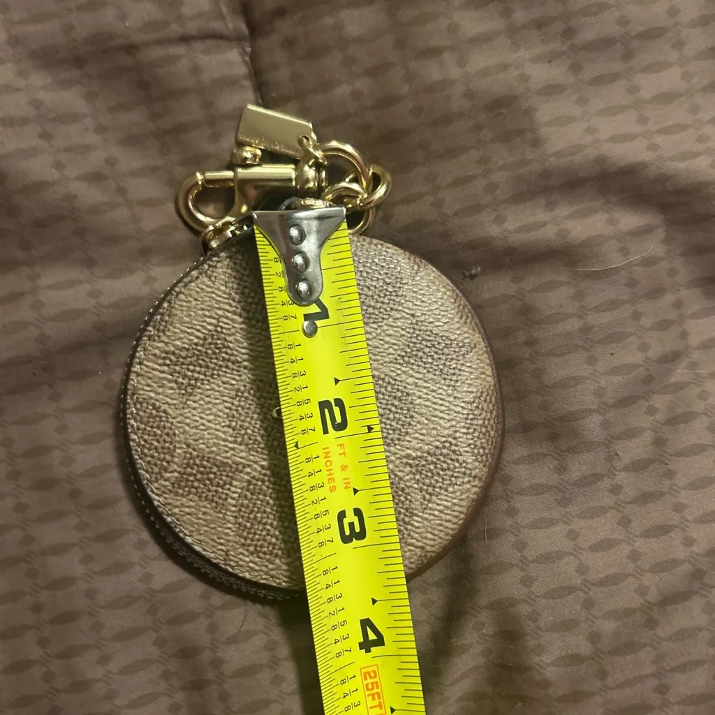 Coach Signature Canvas Circular Coin Pouch bag charm in the color khaki brown - Image 4