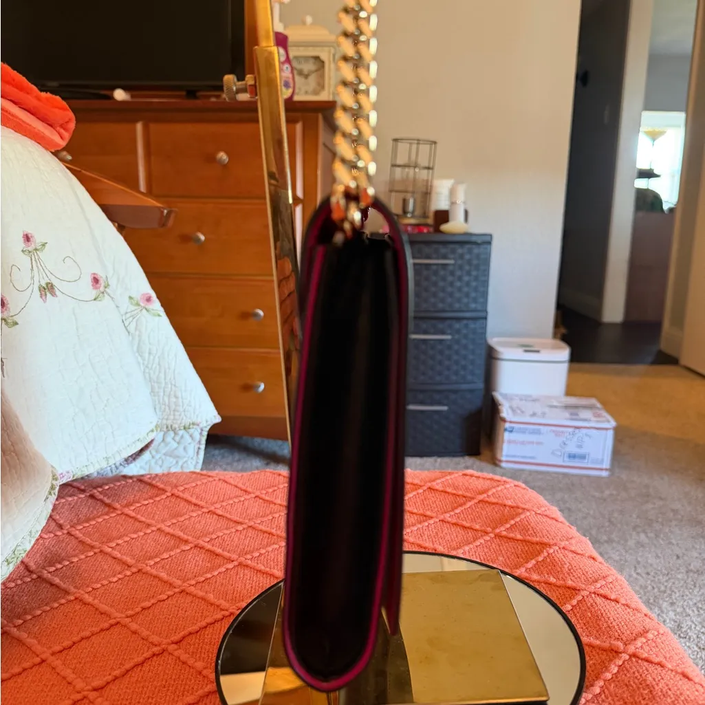 Beautiful black exterior, bright pink interior shoulder and crossbody purse.  - Image 6