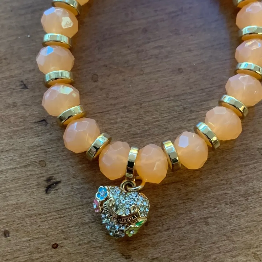 Juicy Couture Stretch Orange Beaded Charm Bracelet with Dangling Heart Charm - Image 2