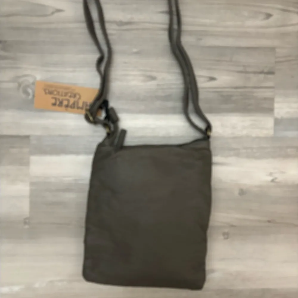 Jassy Chocolate Brown crossbody bag with lots of pockets and a zipper closure - Image 2