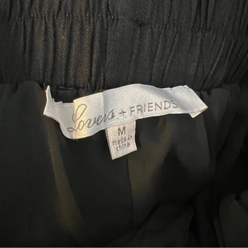 lovers + friends black pull on ruffle hem pants size Medium - Image 5