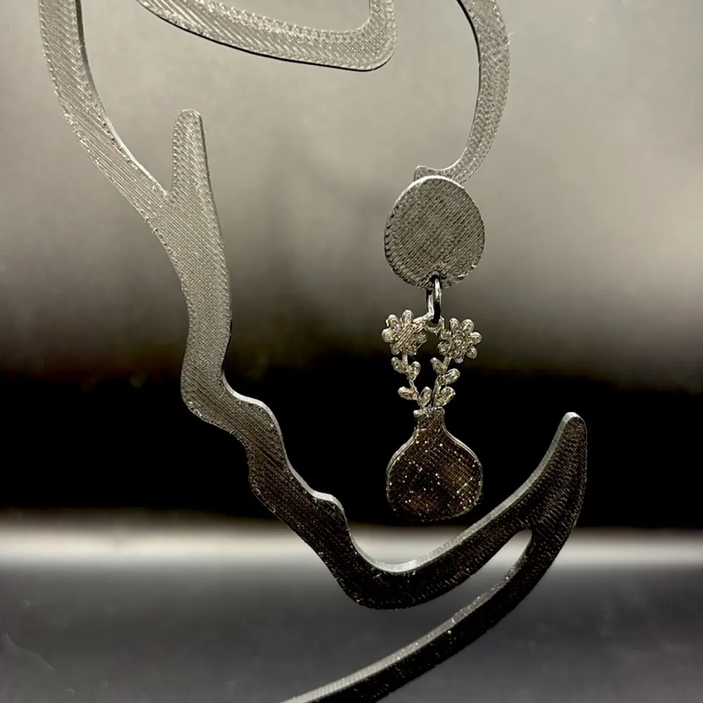 Elegant Black Floral Vase Earrings - Image 2