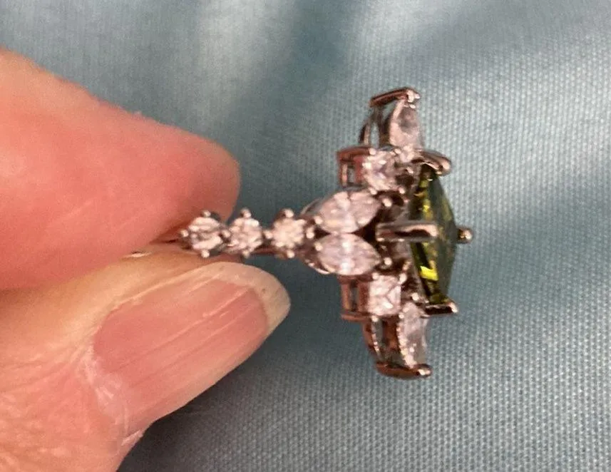 Peridot cubic zirconia rhodium plated ring. Size 8. Clear crystals around ring. - Image 3