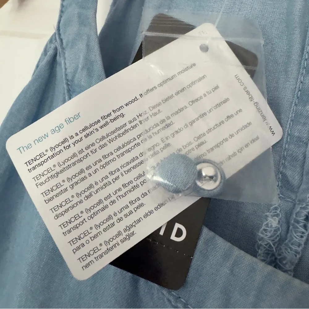 Torrid 100% Tencel Halter Neck Tiered Sleeveless Top in
Light Wash Lyocell Tank - Image 9