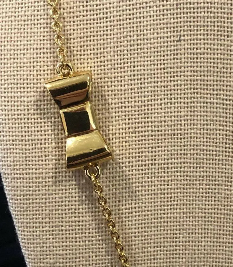 KATE SPADE Gold Tone Gold Enamel Bow Long Necklace - Image 9