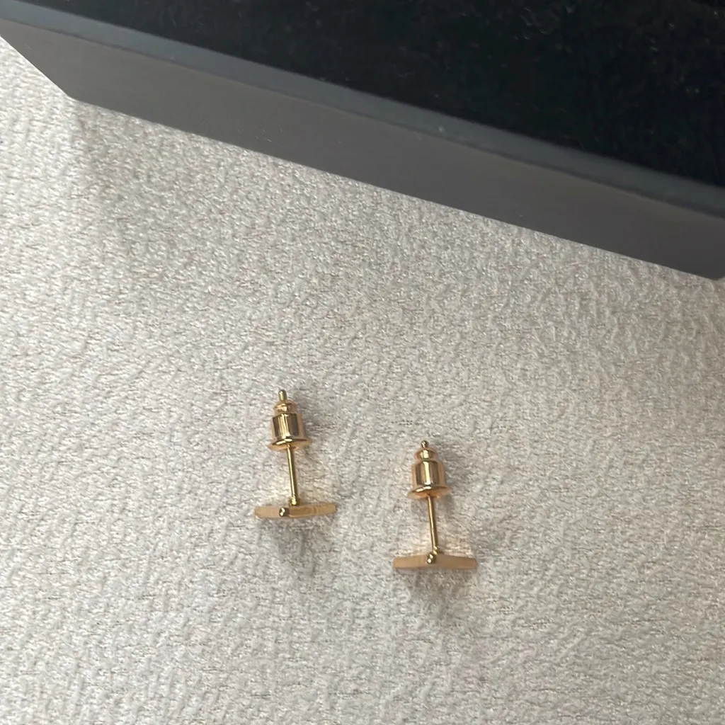 Gold triangle stud earrings - Image 3