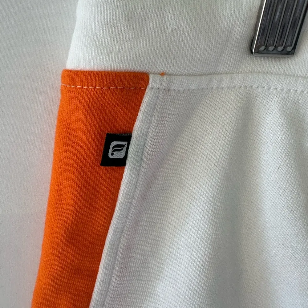 NWT Fabletics Women's Naaru White/Orange Terry Cotton Dolphin Hem Shorts Size M - Image 5