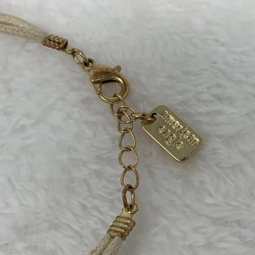 American Eagle 2  bracelets gold tone crosses and fabric cord north star charm - Image 6