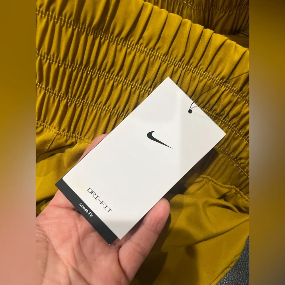 NIKE WORKOUT SHORTS NEW

Nike Women's High-Waisted Running Shorts - Image 6