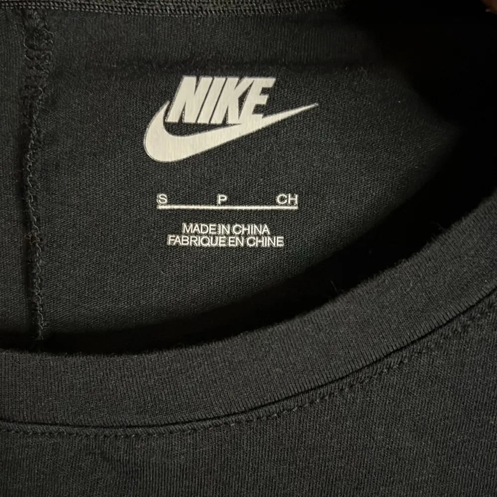 long sleeve black tee with a silver/gold logo size small - Image 2