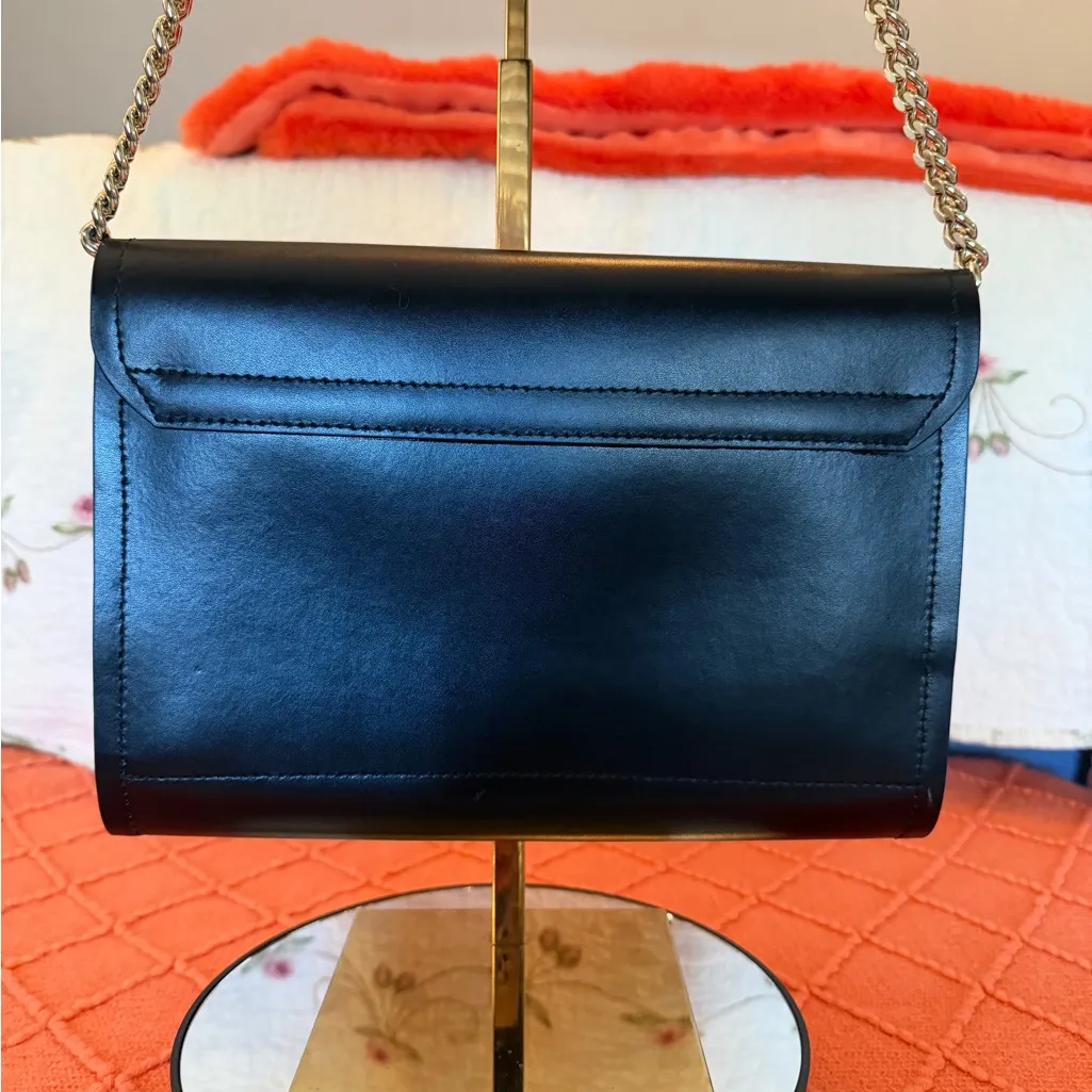 Beautiful black exterior, bright pink interior shoulder and crossbody purse.  - Image 8