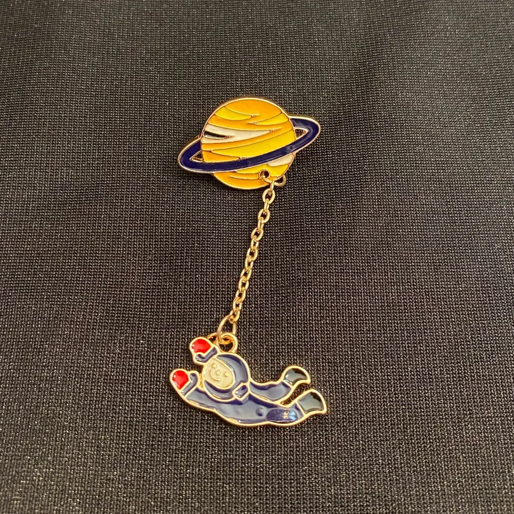 Junior Astronaut goes on their first spacewalk on this enamel pin/magnet. Blue - Image 4