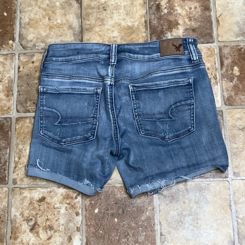 American Eagle Super Stretchy Ripped Cuffed Hem Midi Medium Washed Jean Shorts 4 - Image 4