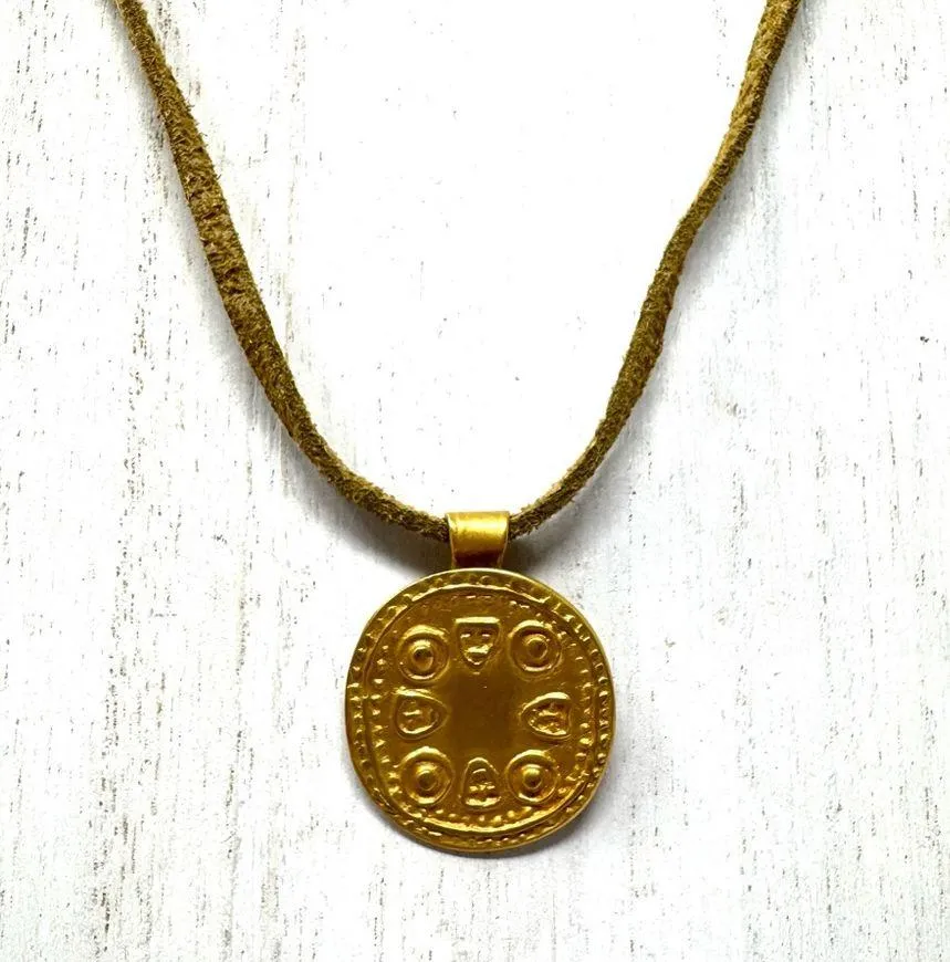 Mayan design gold tone pendant purchased in Costa Rica, on golden suede cord - Image 2