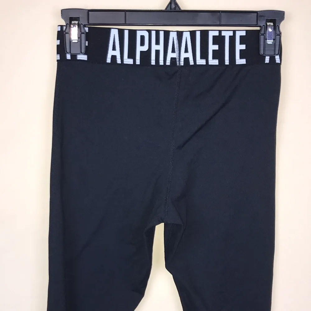 Alphalete Women’s Athletic Spell Out Waistband Criss Cross Cutout Black Leggings - Image 6