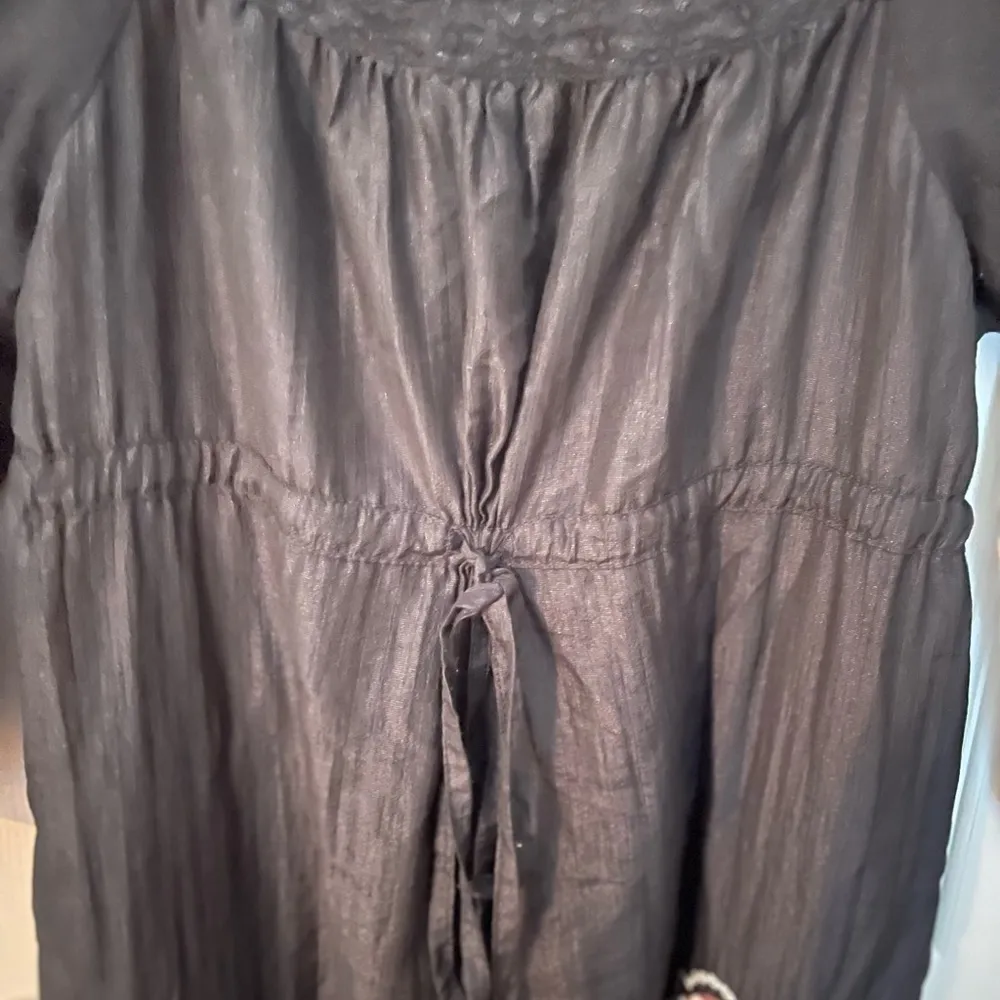 Lulumari drawstring empire waist dress with embroidered floral appliqués. - Image 4