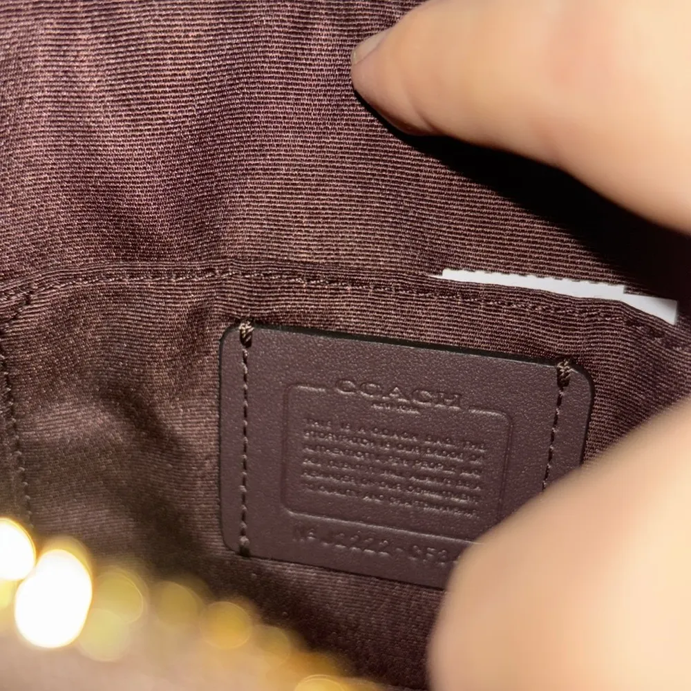 Brown with black coach signs and gold zipper - Image 3