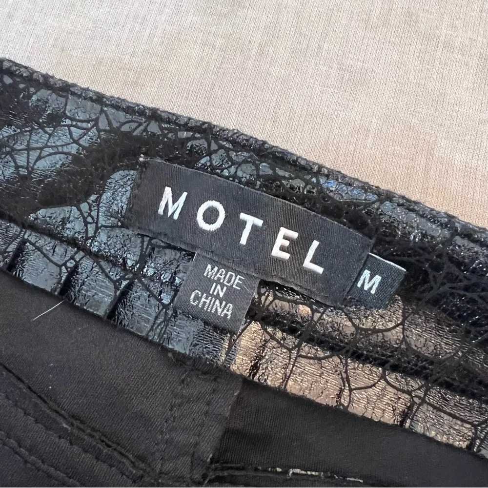 Motel Rocks Black Flared Pants with High Waist and Glossy Finish - Image 11