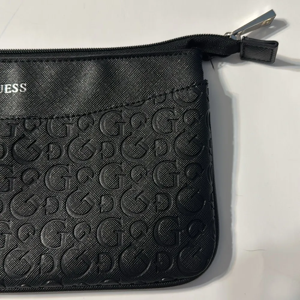 Women’s GUESS Calypso Black Wristlet with logo charm - Image 7