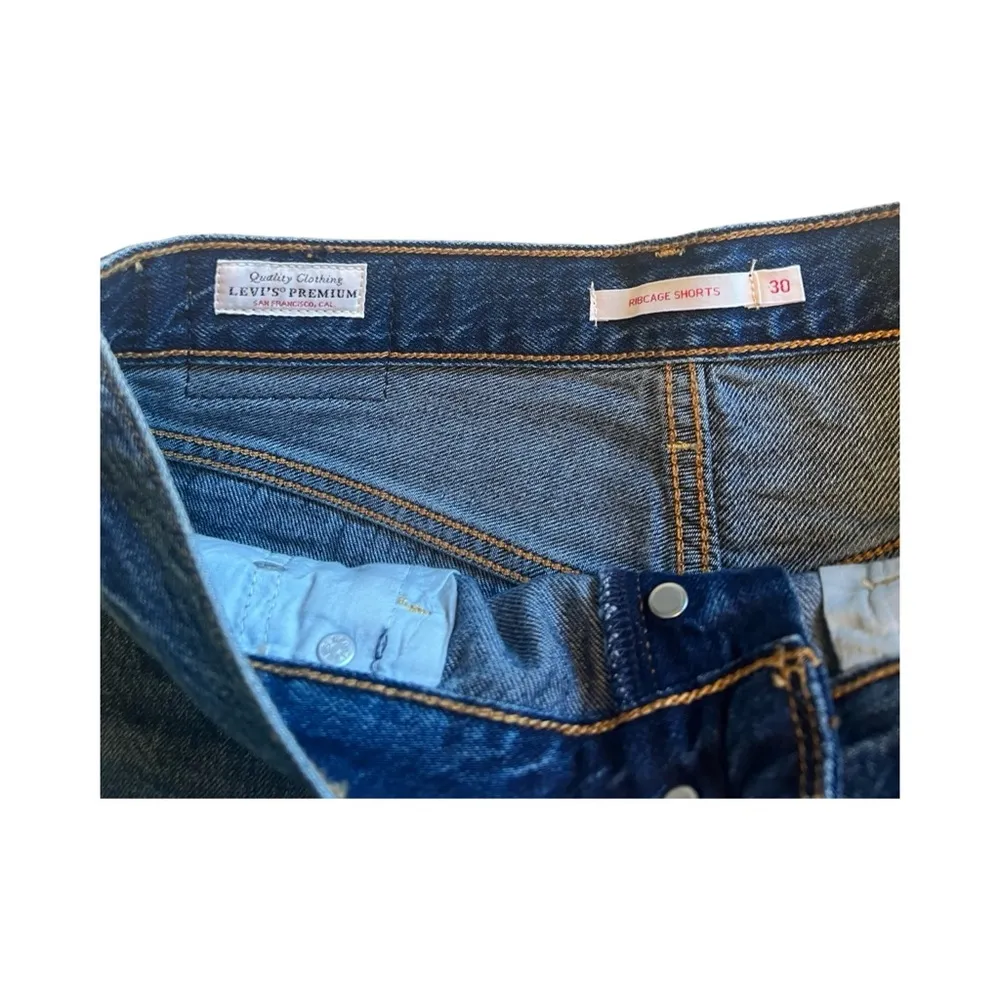 Levi’s Premium Ribcage Jean Shorts Size 30 Blue Medium Wash High Rise Raw Hem - Image 3