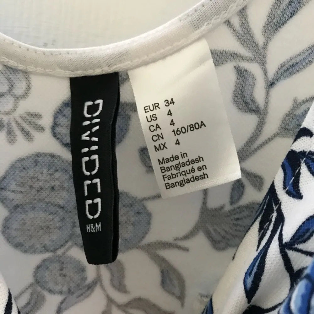 H&M floral white and blue mini dress Size 4 - $9 (64% Off Retail)
