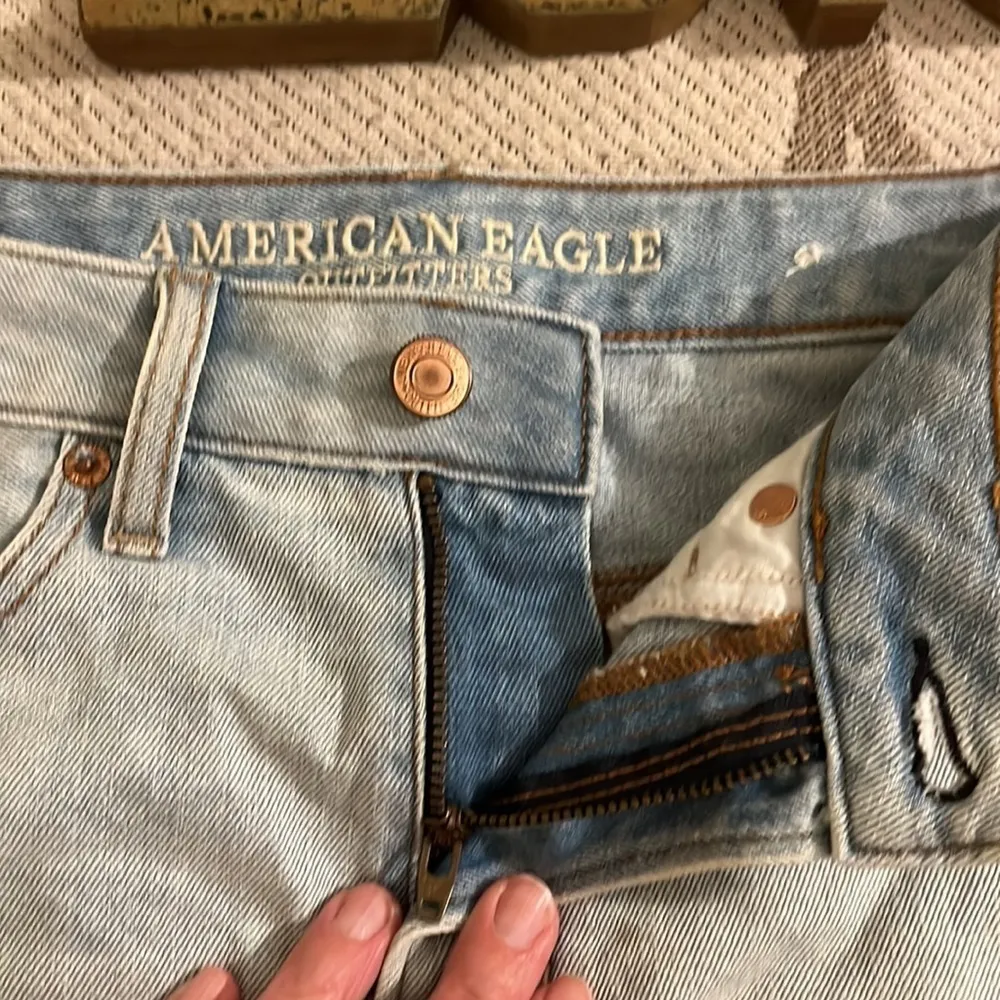 American Eagle Outfitters distressed light wash mini denim skirt - Image 13