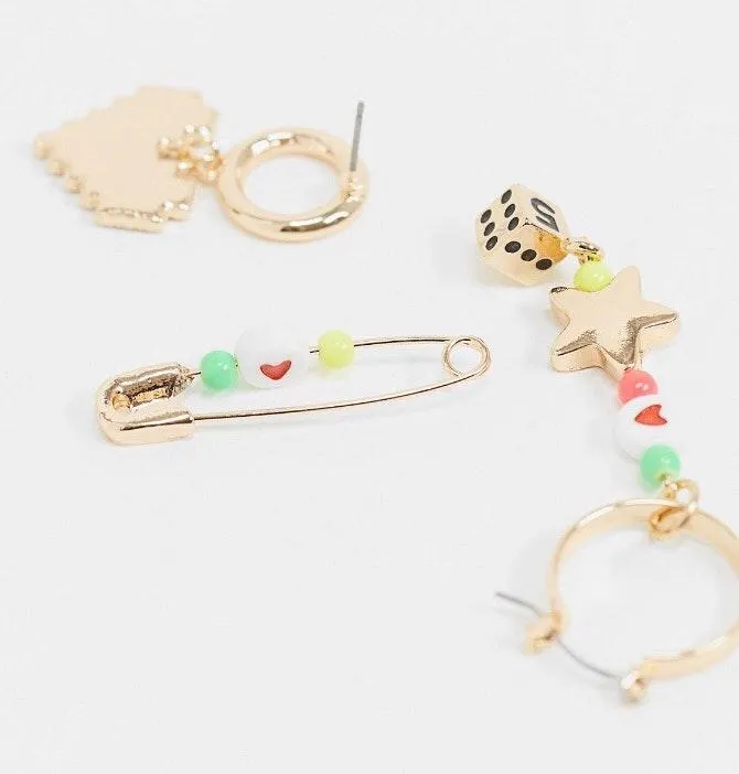 Earrings with playful bead drops and safety pin in gold tone - Image 3
